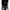Extreme Black Latex Vacuum Bed with a model demonstrating total body immobilization and second-skin compression.