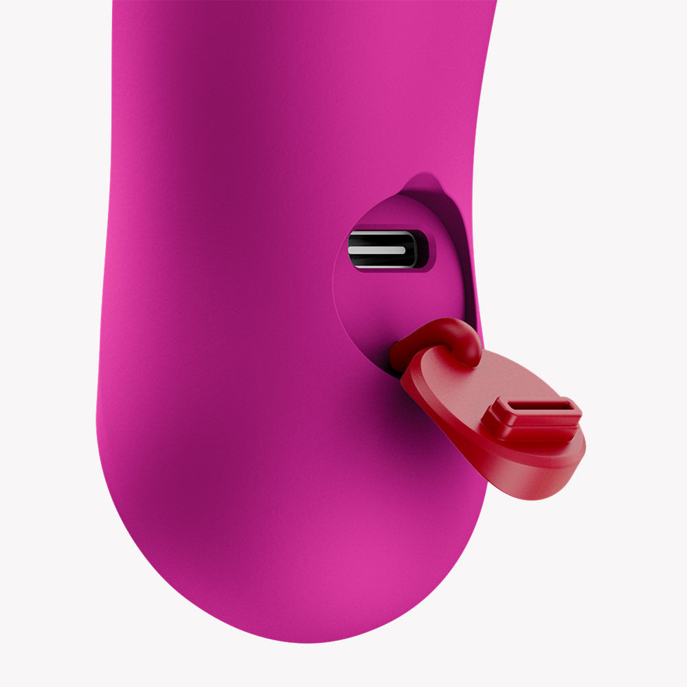 Close-up of the charging port on the Fun Factory Bijou Bullet Vibrator Magenta with a red cap.